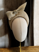 Load image into Gallery viewer, Beige Bow Fascinator 7 cms Tall Headband, With Silver Thread, Halo Shape, Races Headpiece