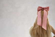 Load image into Gallery viewer, Blush Pink Satin Bow Headband Fascinator, on a Sinamay Halo Base, with tails