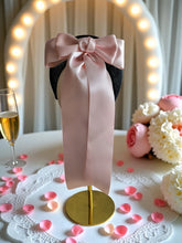 Load image into Gallery viewer, Pink Satin Back Bow Headband on Black Sinamay Halo Base with Tails