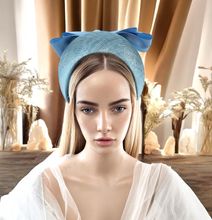 Load image into Gallery viewer, Pale Blue Satin Bow Headband Fascinator, on a Sinamay Halo Base, with tails