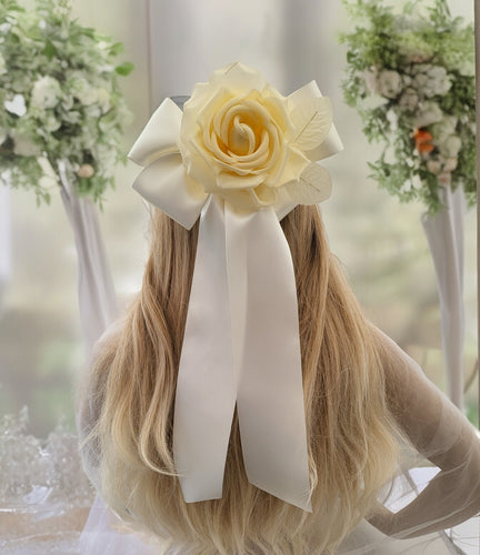 Ivory Bow Flower Fascinator on a sinamay base with hair clip,