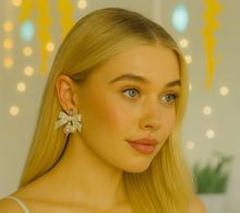 Load image into Gallery viewer, Clip-On Ivory Satin Bow Earrings with Diamante Sparkle and Pearl Beads – Elegant Bridal or Occasion Jewellery
