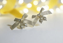 Load image into Gallery viewer, Clip-On Ivory Satin Bow Earrings with Diamante Sparkle and Pearl Beads – Elegant Bridal or Occasion Jewellery