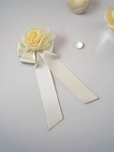 Ivory Bow Flower Fascinator on a sinamay base with hair clip,